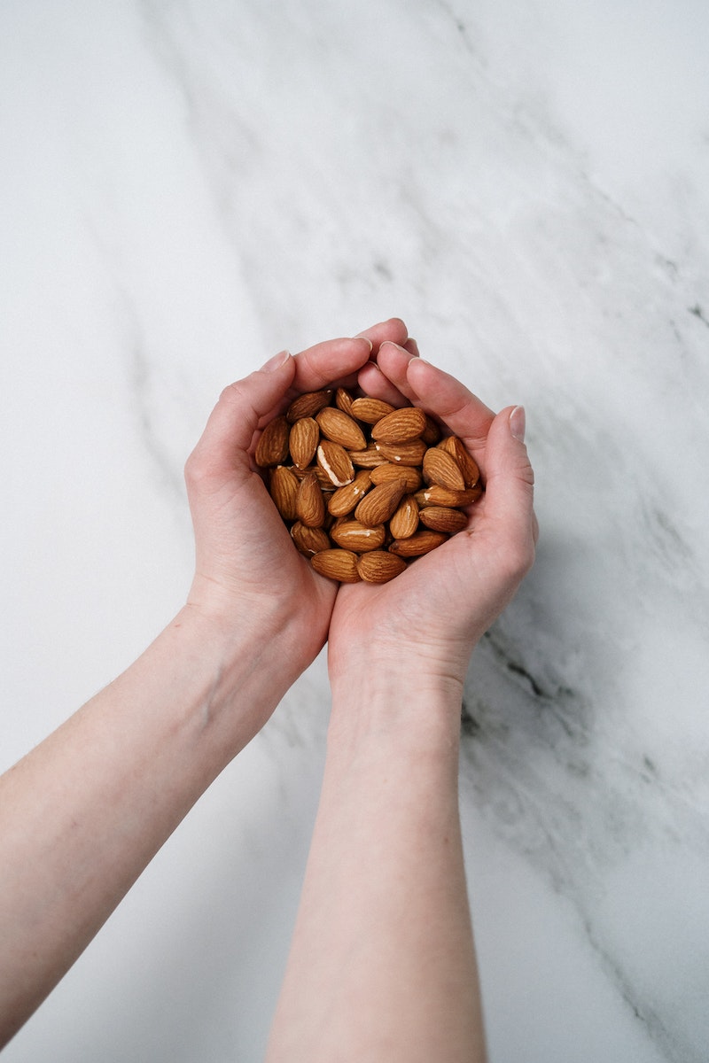 Person Holding Almonds