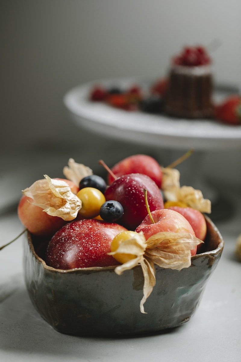 Ripe fruits and berries in bowl